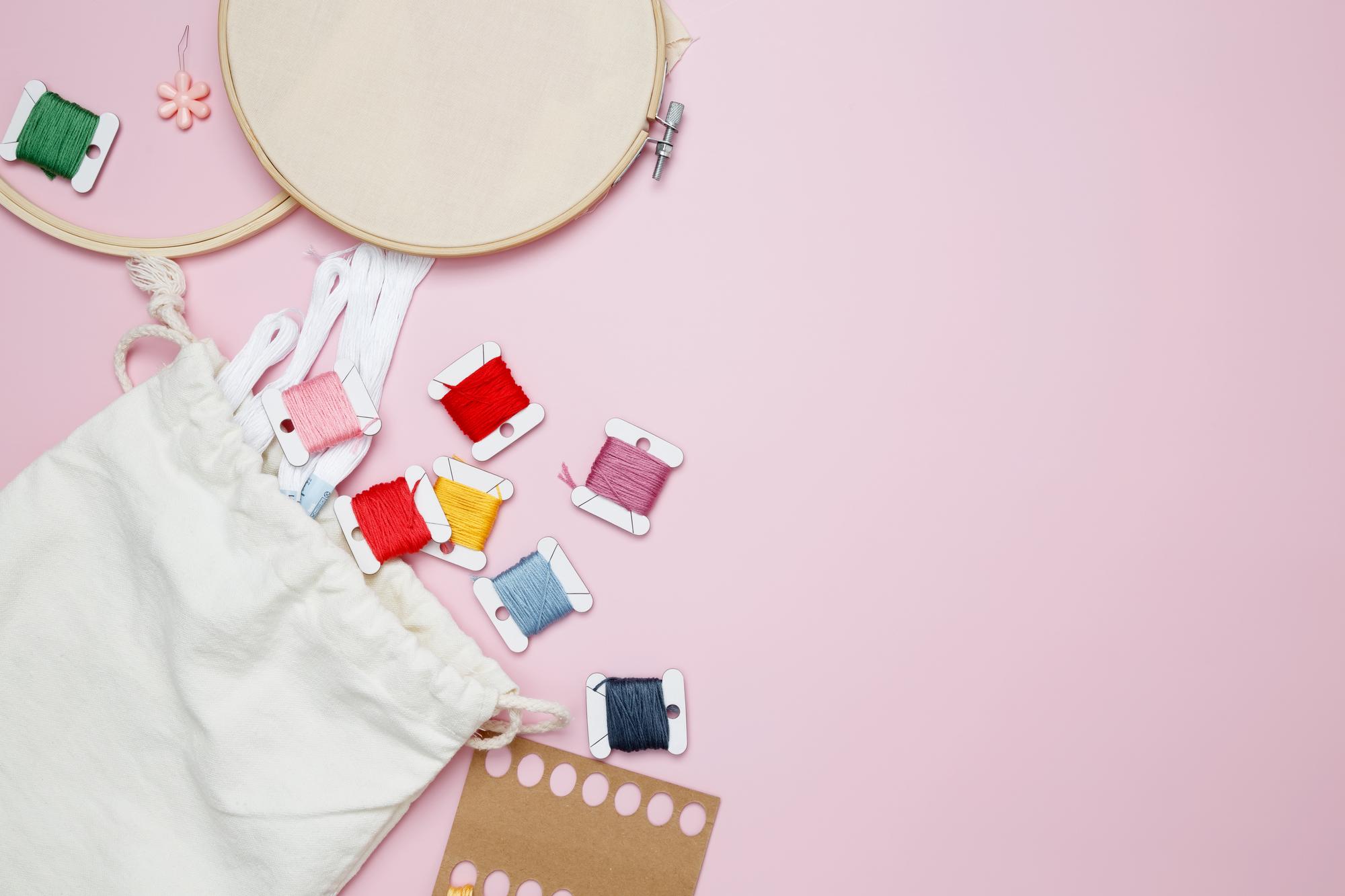 Flatlay of embroidered swatches and price list
